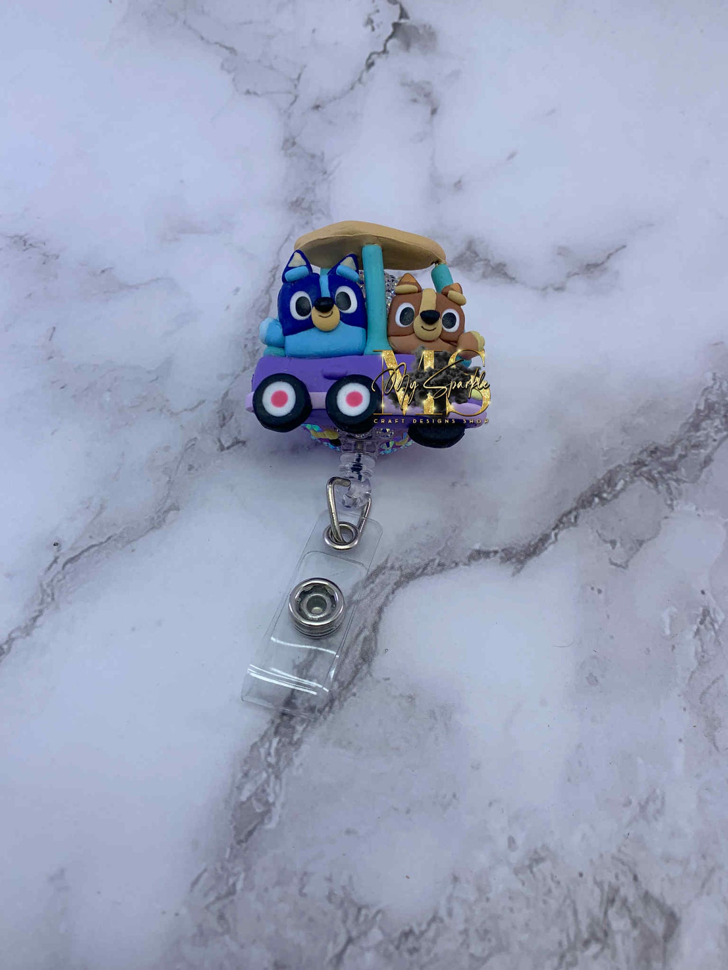 Blue Sister Dogs Clay Badge Reel