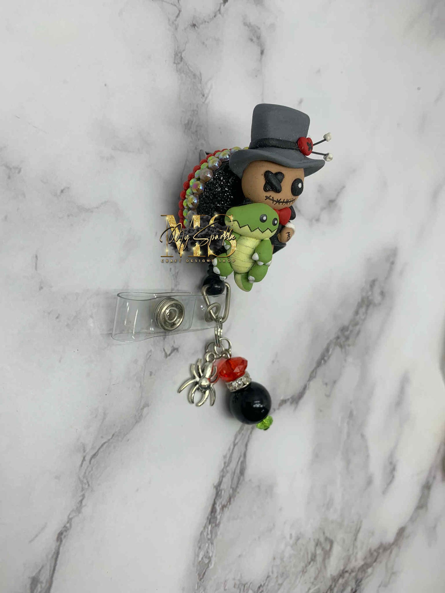 Voodoo Doctor Doll Clay Badge Reel