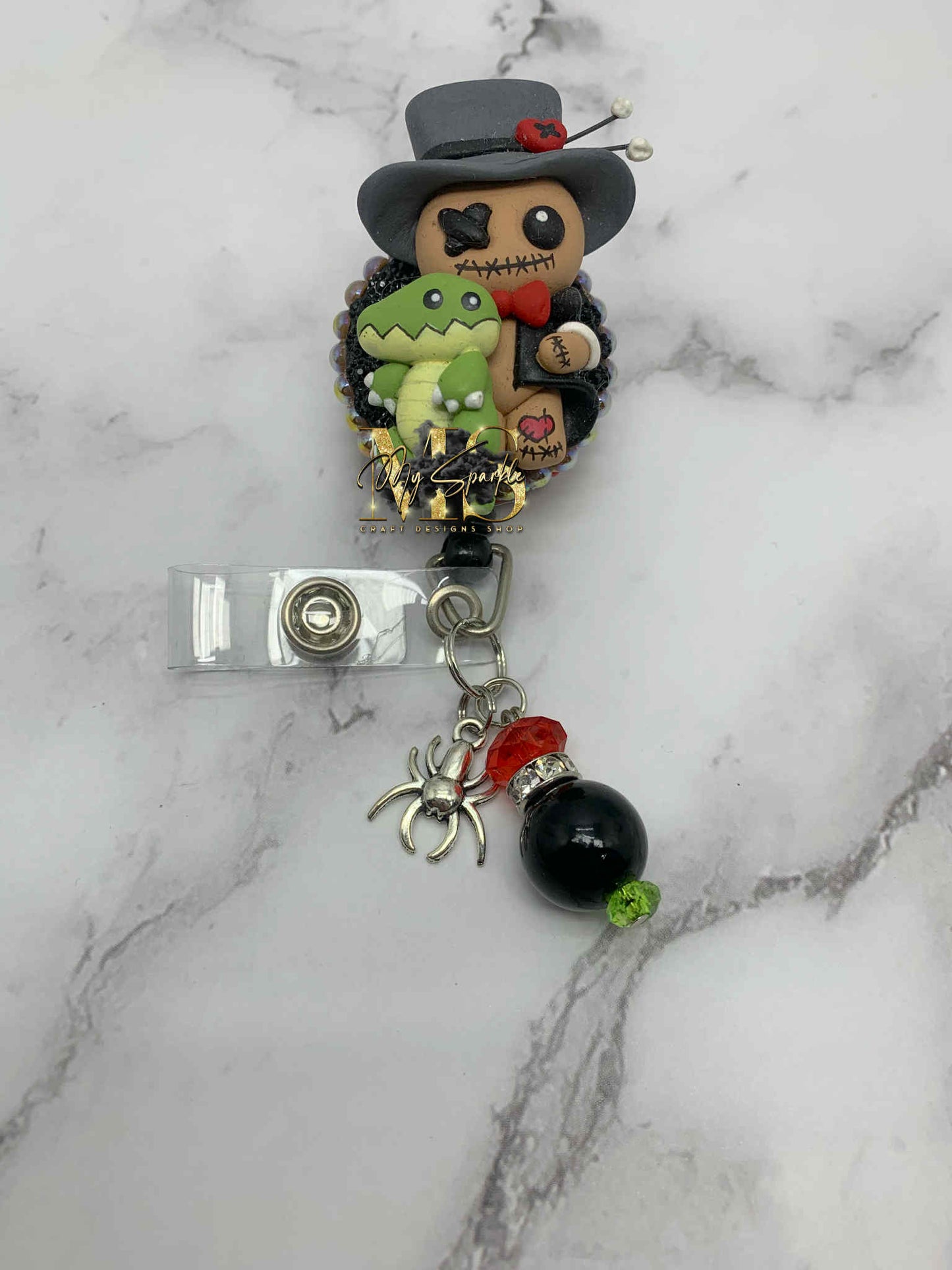 Voodoo Doctor Doll Clay Badge Reel