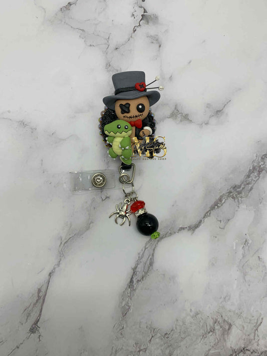 Voodoo Doctor Doll Clay Badge Reel
