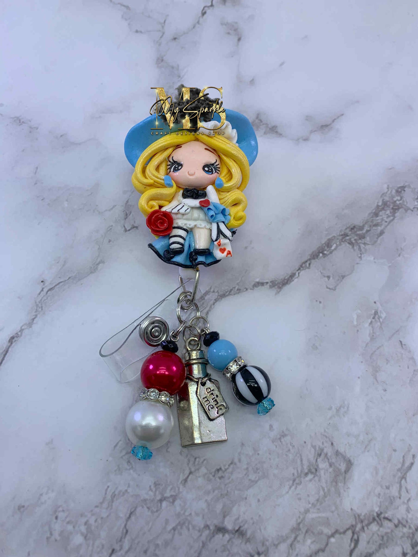 Girl Wonderland Clay Badge Reel
