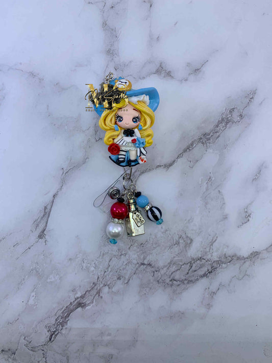 Girl Wonderland Clay Badge Reel