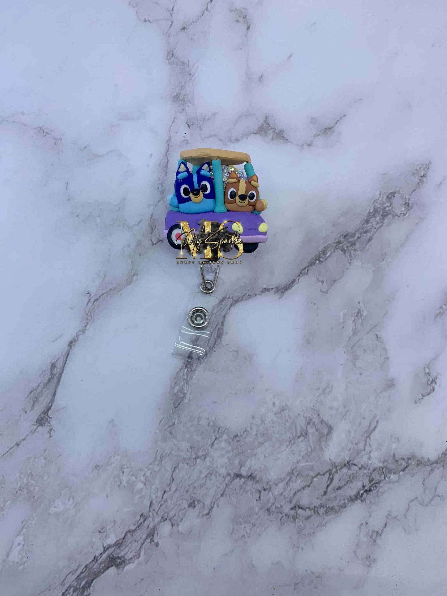 Blue Sister Dogs Clay Badge Reel